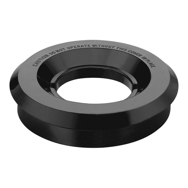 A black circular rubber lid with a hole in the center.