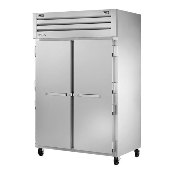 A large silver True refrigerator with two doors.