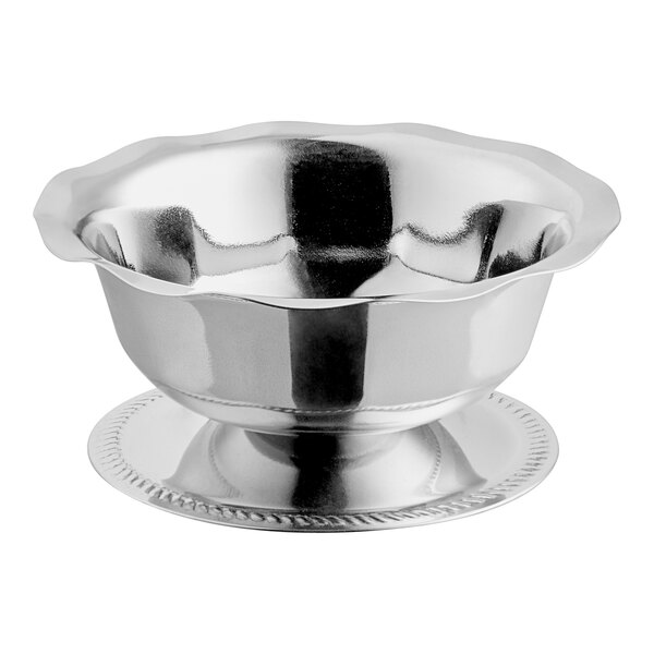 A silver bowl with a ruffled edge.
