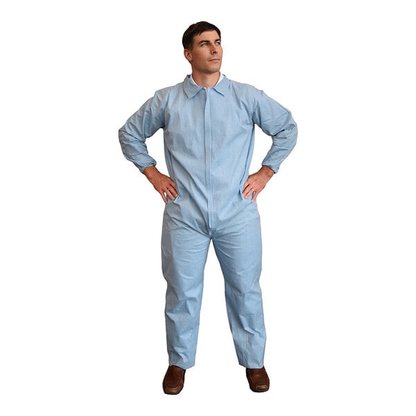 A man in blue Cordova flame-resistant coveralls with elastic wrists.