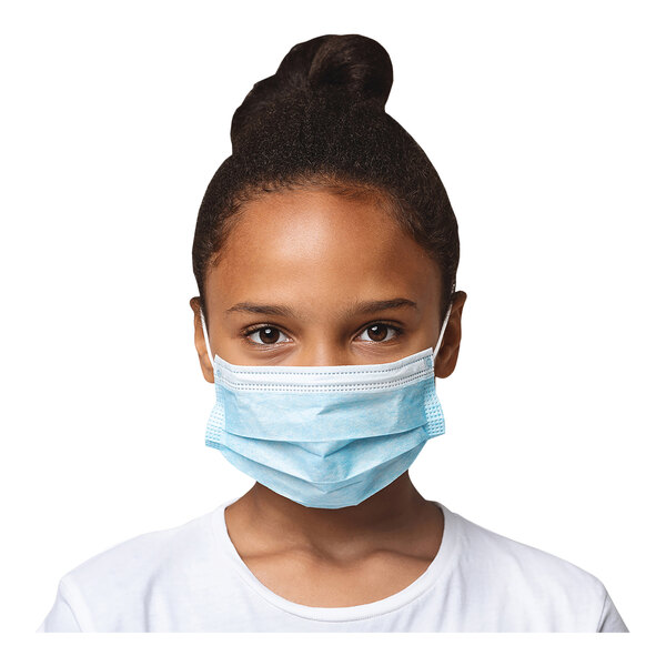 A young girl wearing a light blue Cordova face mask.