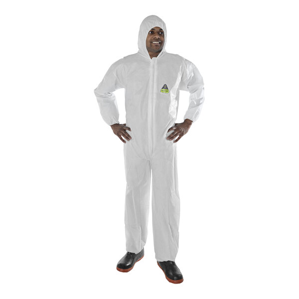 A man wearing a white Cordova Defender coverall with an elastic hood, wrists, and ankles.