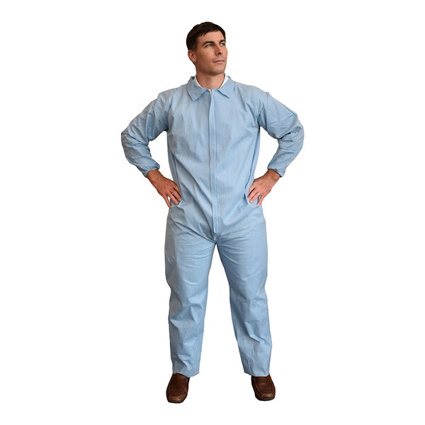 A man wearing blue Cordova flame-resistant coveralls.