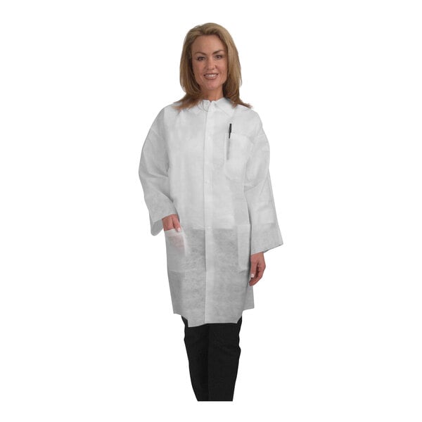 A woman wearing a white Cordova heavy weight polypropylene lab coat.