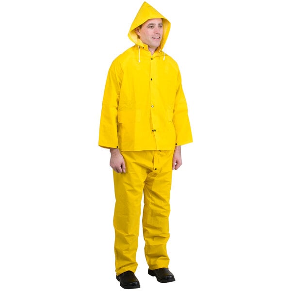 A man wearing a yellow Cordova StormFront rainsuit.