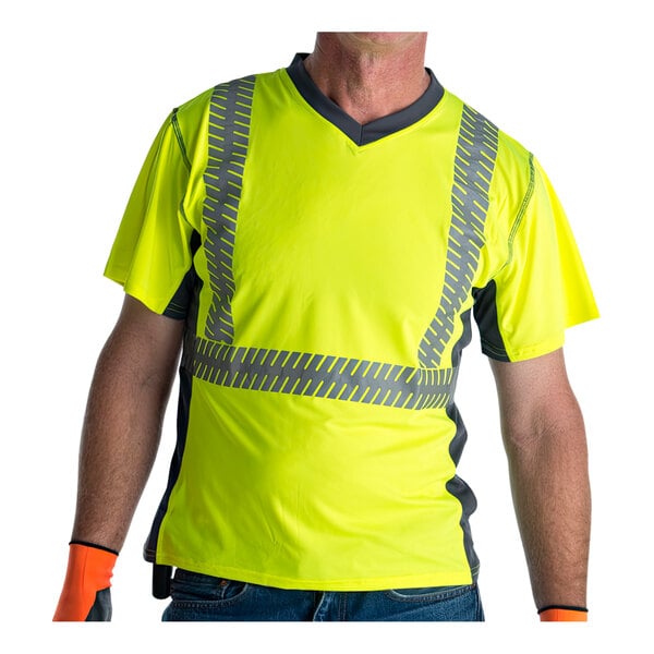 A man wearing a Cordova lime yellow safety shirt with gray side panels and reflective tape.