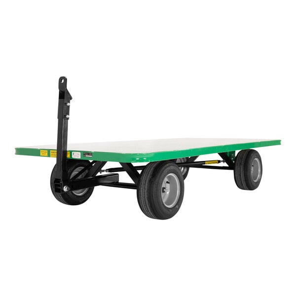 A green and white Valley Craft quad-steer trailer with black wheels.