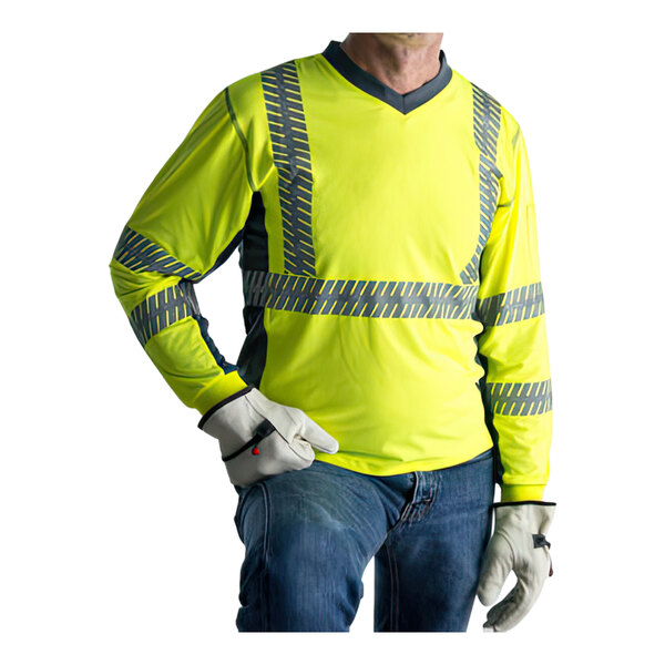 A man wearing a Cordova hi-vis lime safety shirt with gray side panels and reflective tape.