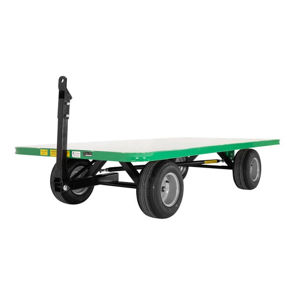 A green and white Valley Craft quad-steer trailer with wheels.