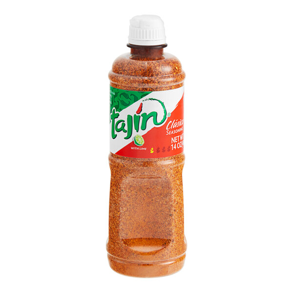 A close up of a jar of Tajin Classic Seasoning on a white background.