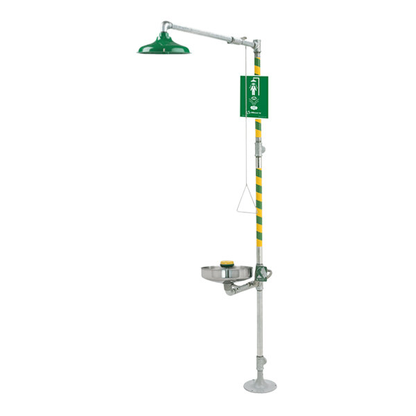 A green and white Haws emergency shower and eye/face wash station with a green hose.