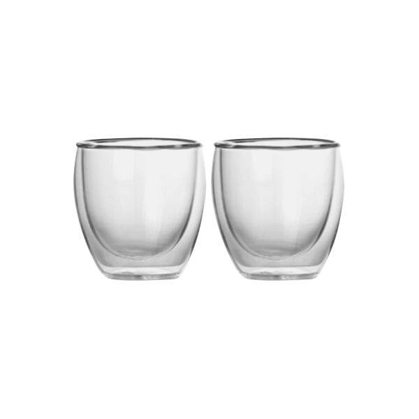 Two Bruer clear glass cups with a curved edge on a white background.