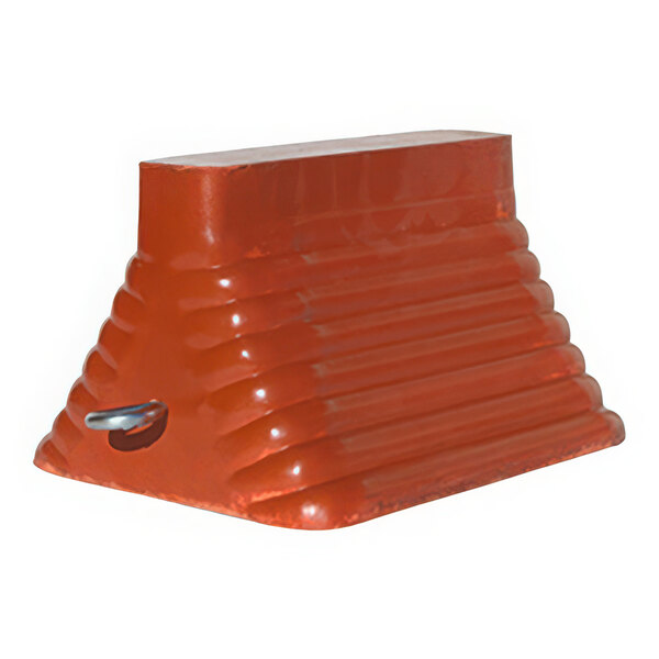 An orange molded rubber wheel chock with a metal hook.