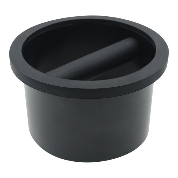 A black cylinder with a black lid and a handle.