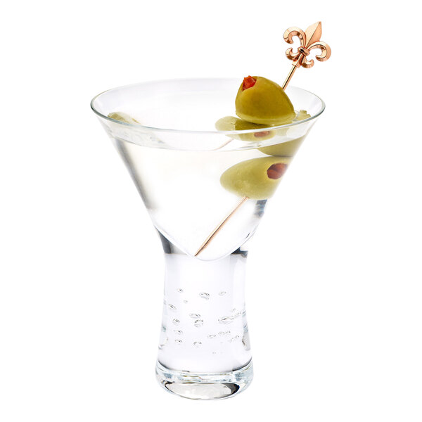A martini with green olives on a Barfly copper-plated cocktail pick with a Fleur de Lis top.