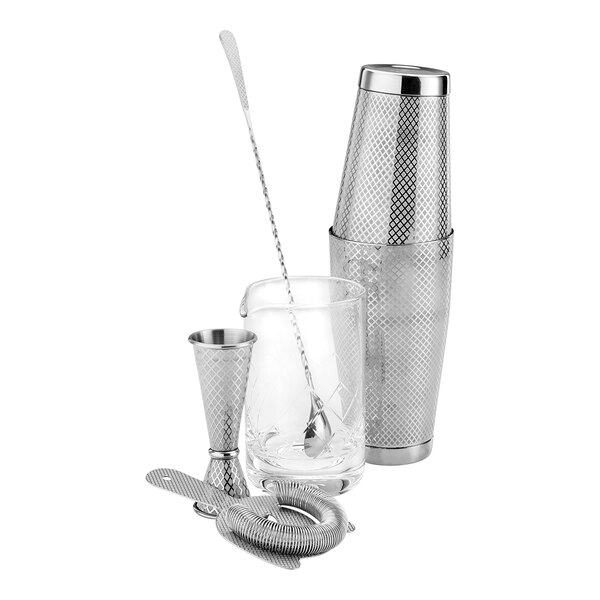 A silver Barfly stainless steel cocktail shaker, glass, and spoon.