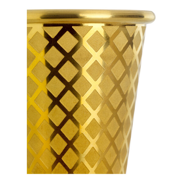 A gold-plated Barfly Japanese style jigger with a diamond lattice design.