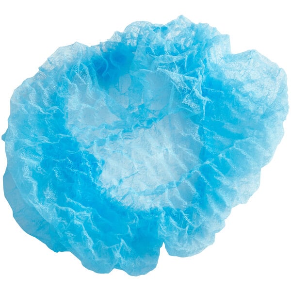 A blue Choice polypropylene bouffant cap in a plastic bag with a hole in it.