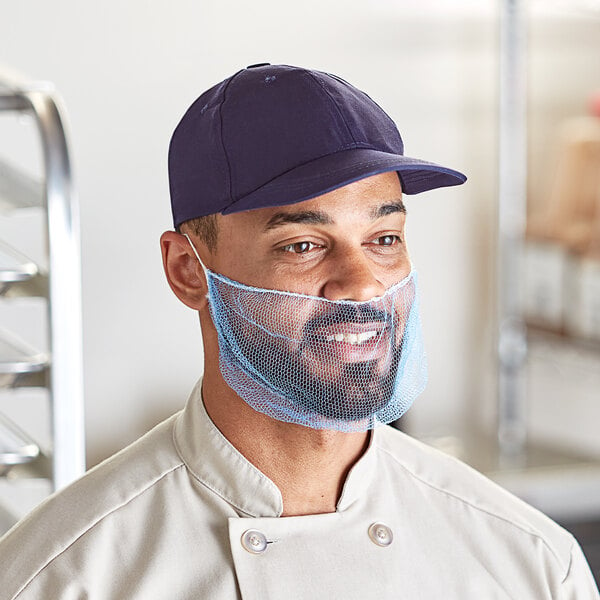 A man wearing a blue nylon beard net over his face.