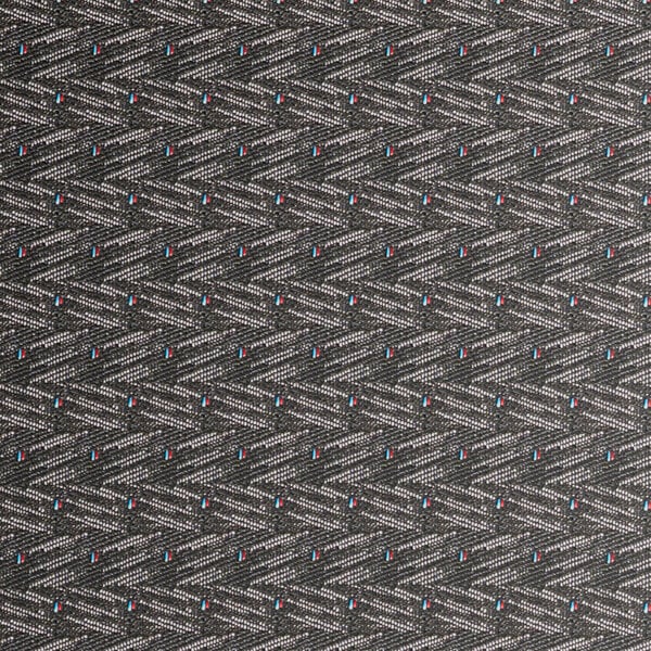 A close up of black pattern fabric on a Lancaster Table & Seating banquet chair.