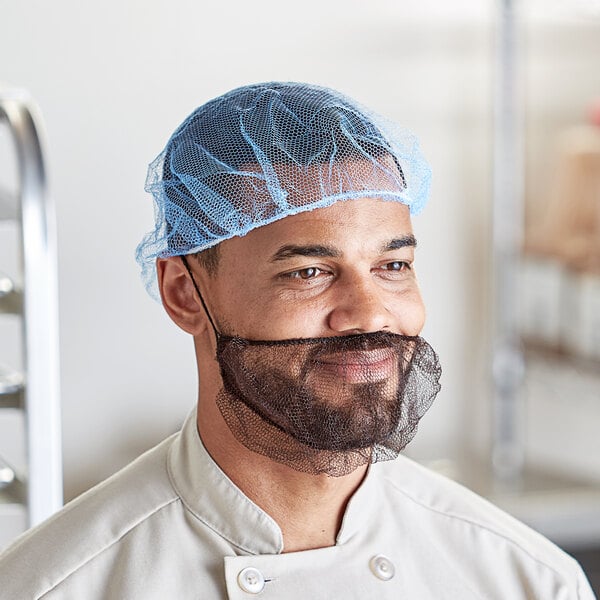 A man wearing a blue Choice nylon hairnet.