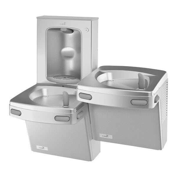 A stainless steel Oasis water fountain with two faucets.