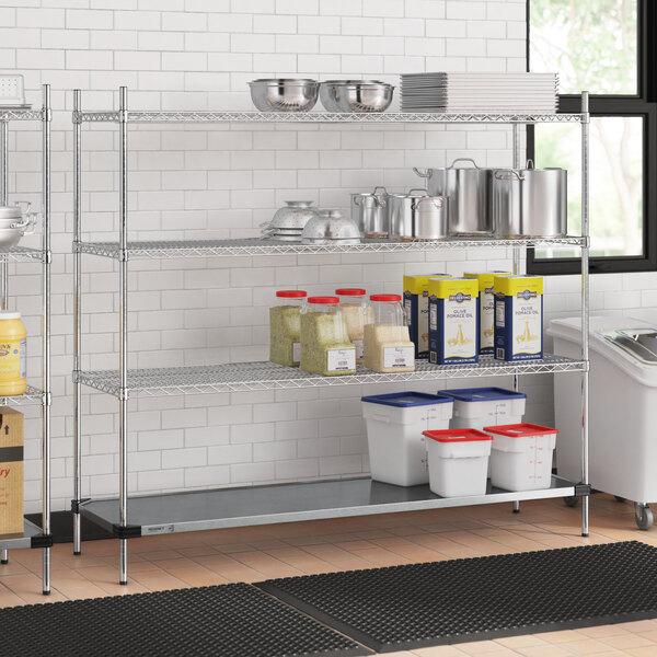 A metal Regency wire shelving unit with food containers on white and blue plastic bins.