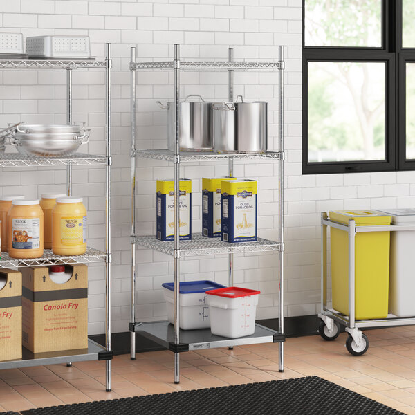 Regency chrome wire shelving with containers on the bottom shelf in a kitchen.