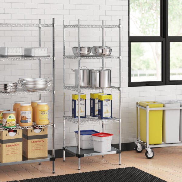 A Regency chrome wire shelving unit with a galvanized steel bottom shelf in a school kitchen.