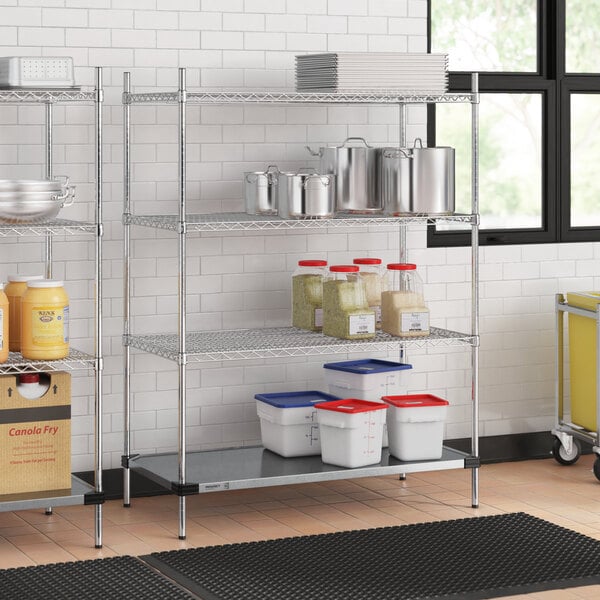 Regency chrome wire shelving in a kitchen with white and blue plastic containers on the bottom shelf.