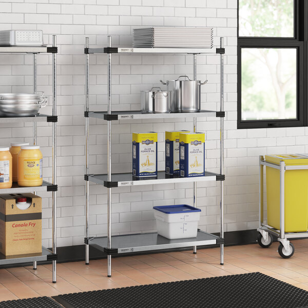 A Regency galvanized steel shelf with containers on it, including blue and yellow containers.