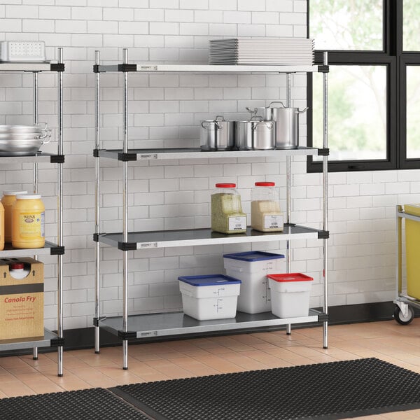 A Regency galvanized steel shelf with food containers on it.