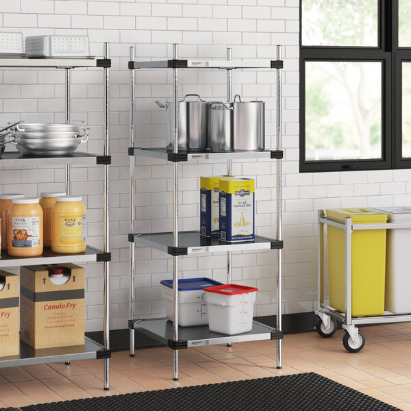 Regency galvanized steel shelves in a kitchen with food containers and buckets.