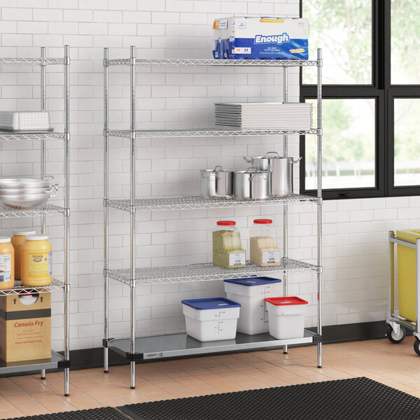 Regency metal wire shelving in a school kitchen with food items on it.