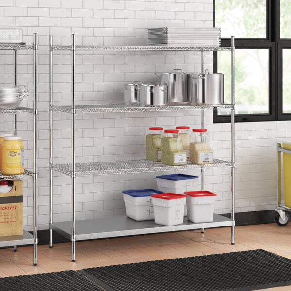 Stainless steel wire shelving unit with white and red plastic containers on the bottom shelf.