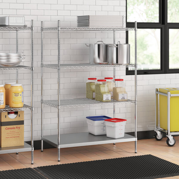 A stainless steel wire shelf kit with solid stainless steel bottom shelves holding containers.
