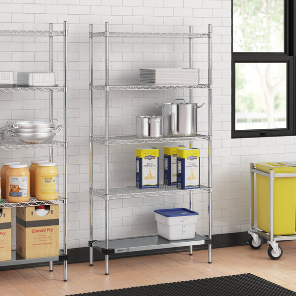 A Regency metal wire shelving unit in a school kitchen.