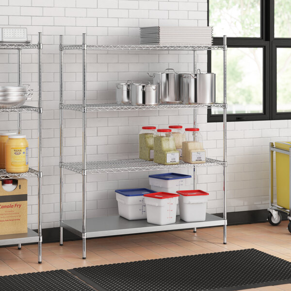 A stainless steel wire shelf kit with solid stainless steel shelves in a kitchen.