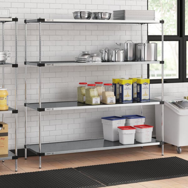 A four-shelf galvanized steel shelving unit with various kitchen items stored on it.