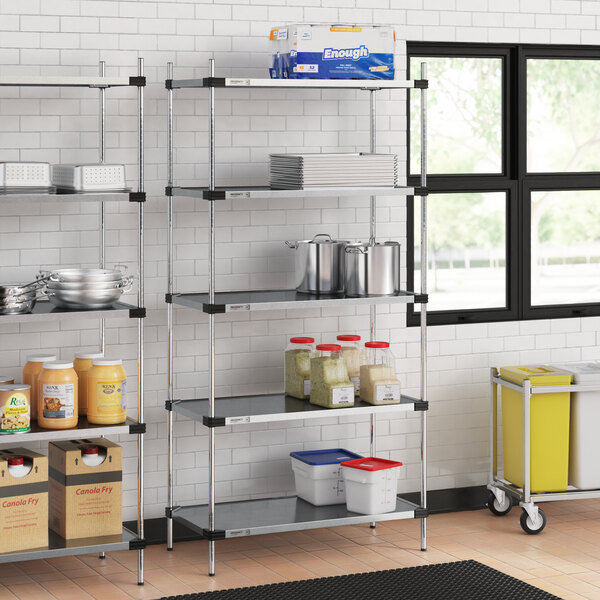 Regency galvanized steel shelves in a school kitchen.