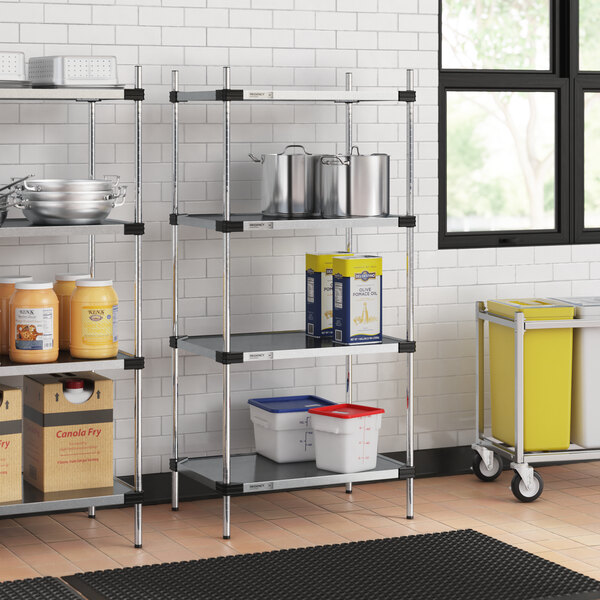 Regency shelves in a professional kitchen with containers on the shelves.