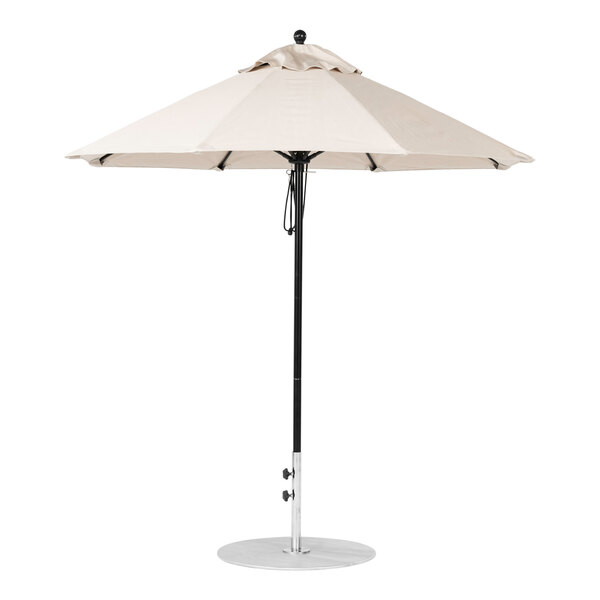 A white umbrella with a black pole.
