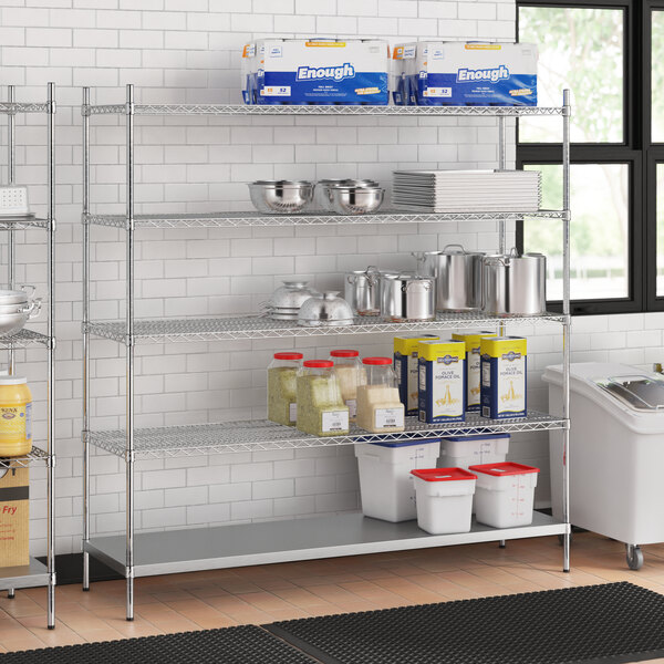 A stainless steel wire shelf kit with solid shelves holding food containers.
