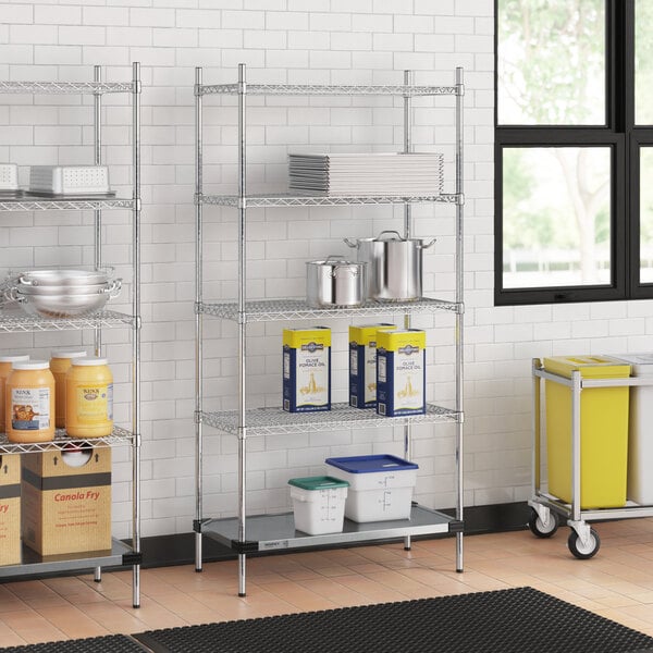 A Regency chrome wire shelving unit with solid galvanized steel shelves in a kitchen.