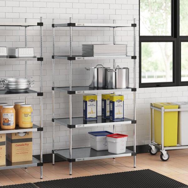 A five-shelf galvanized steel shelving unit with 74-inch posts, used for storage in commercial or industrial settings.