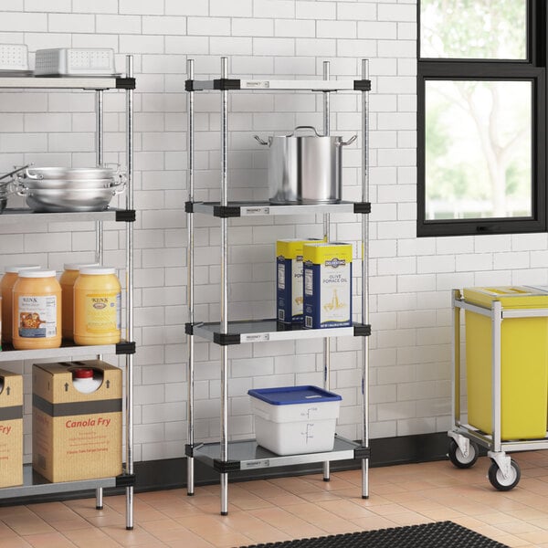 Regency galvanized steel shelves in a kitchen with containers on them.