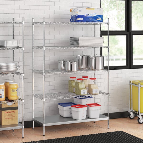 A stainless steel wire shelving unit with solid stainless steel shelves.