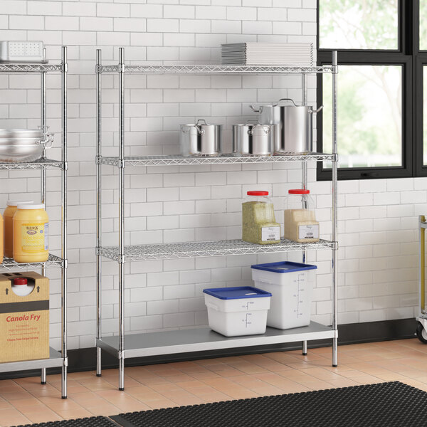 A stainless steel wire shelving unit with solid stainless steel shelves.
