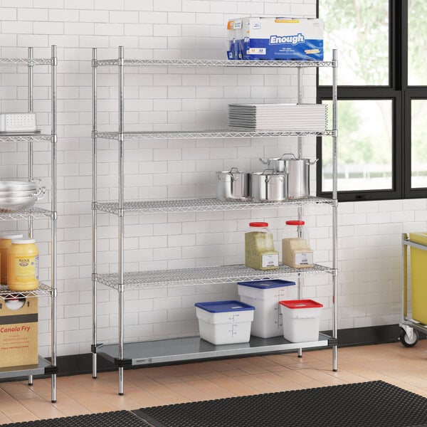 A metal Regency wire shelving unit in a kitchen with food on the shelves.