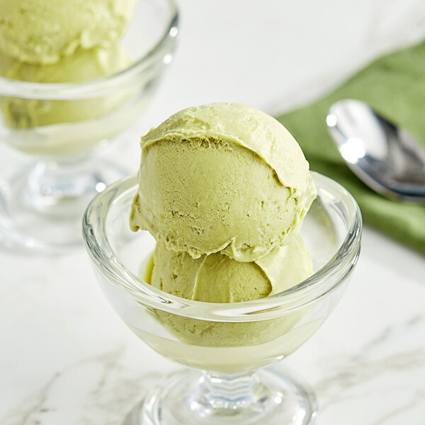 A close-up of a scoop of Acai Roots Matcha Cream Sorbet in a glass bowl.